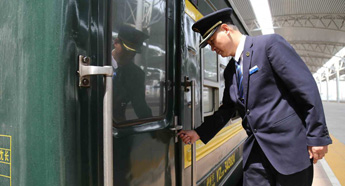 Train attendant holds keys to railway progress